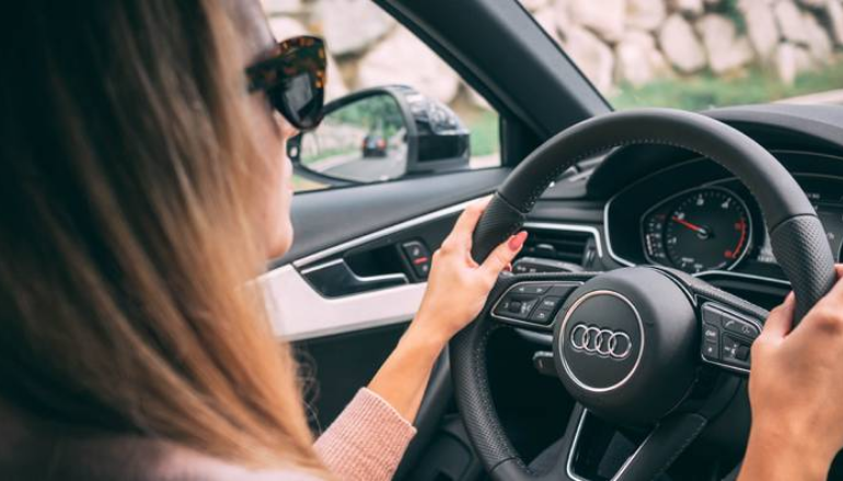 Student practicing attentive driving inside a car
